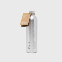 Tall metal bottle with printed logo and paper tag on grey background