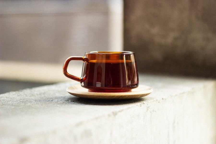 KINTO Sepia cup and saucer on concrete - BindleStore.